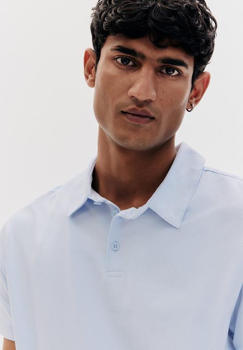 H&M - Slim fit polo shirt - light blue