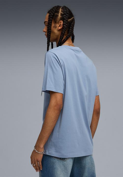 PUMA - Wardrobe ess sports legacy ii graphic tee - Cool Blue