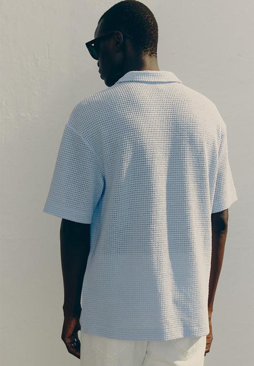 H&M - Loose fit waffled polo shirt - light blue