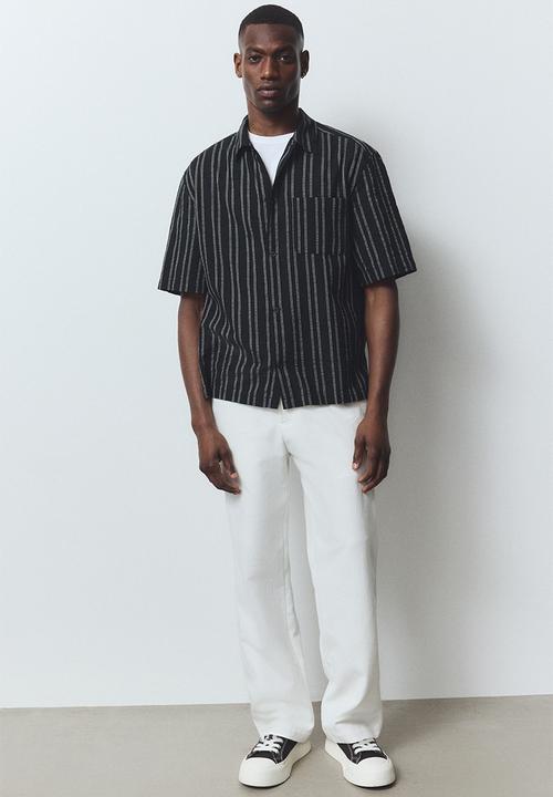H&M - Regular fit short-sleeved shirt - black/striped