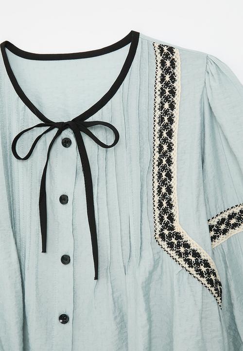Pop Candy - Pin tucked boho blouse with woven trim detail - light blue/mutli