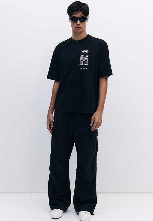 H&M - Loose fit washed t-shirt - black triangle d'or