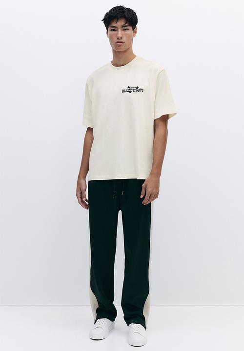 H&M - Loose fit washed t-shirt - beige/avenue