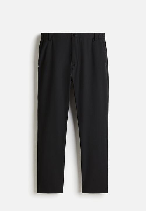 H&M - Slim fit trousers - black