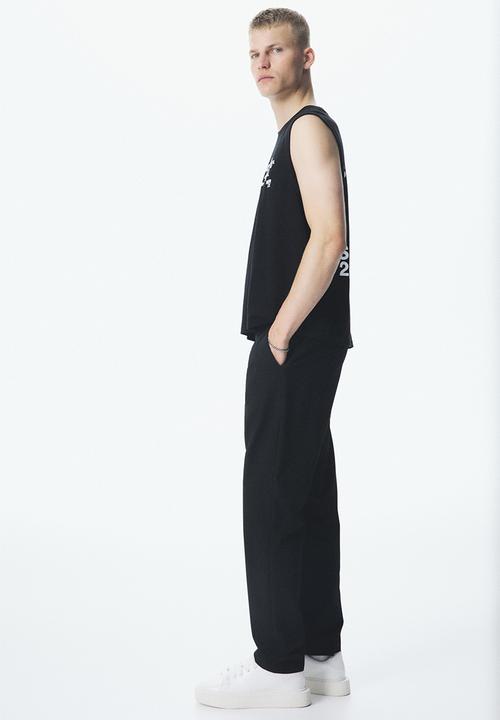 H&M - Slim fit trousers - black