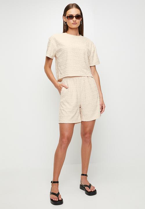 Steve Madden - Ladies bella embossed logo jogger shorts - stone