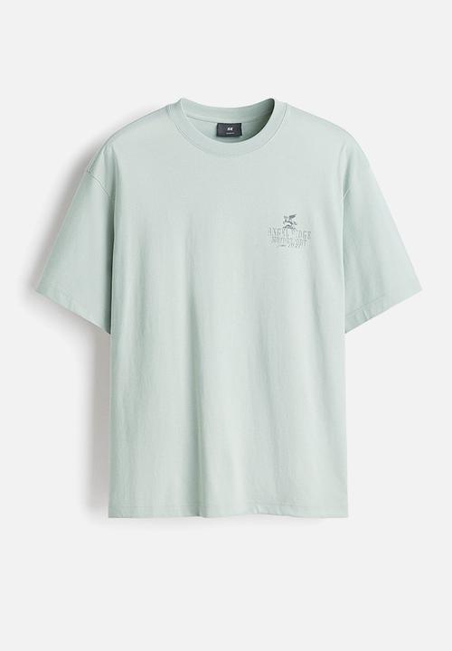 H&M - Loose fit printed t-shirt - sage green angel ridge