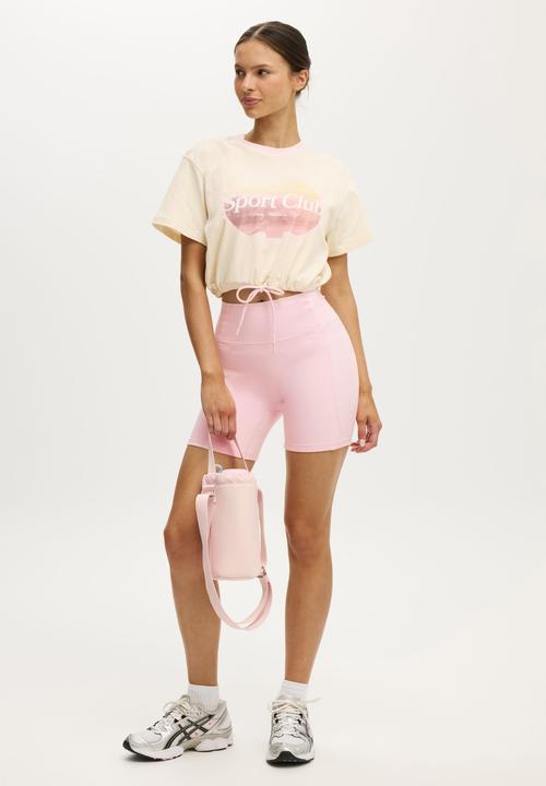 Cotton On - Active Graphic Tie Up Tee - Coconut Milk/Sport Club