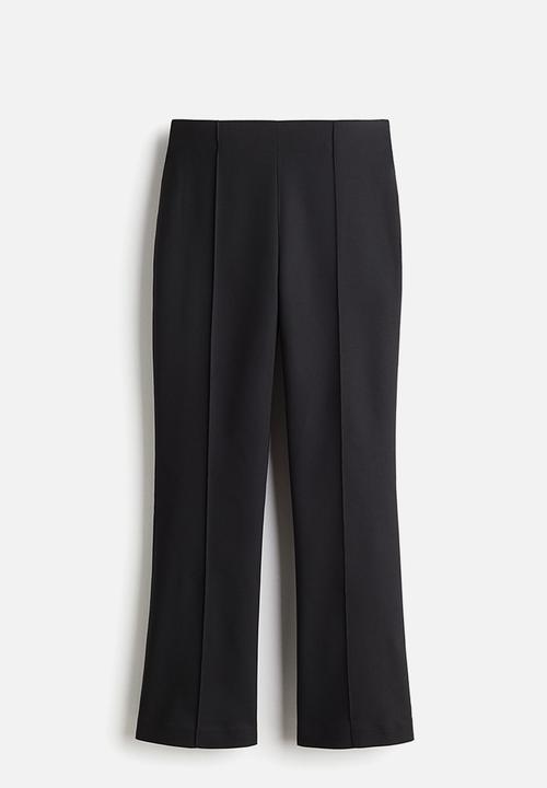 H&M - Flared crease-front trousers - black