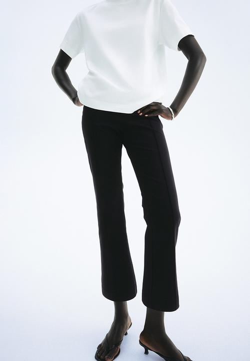 H&M - Flared crease-front trousers - black