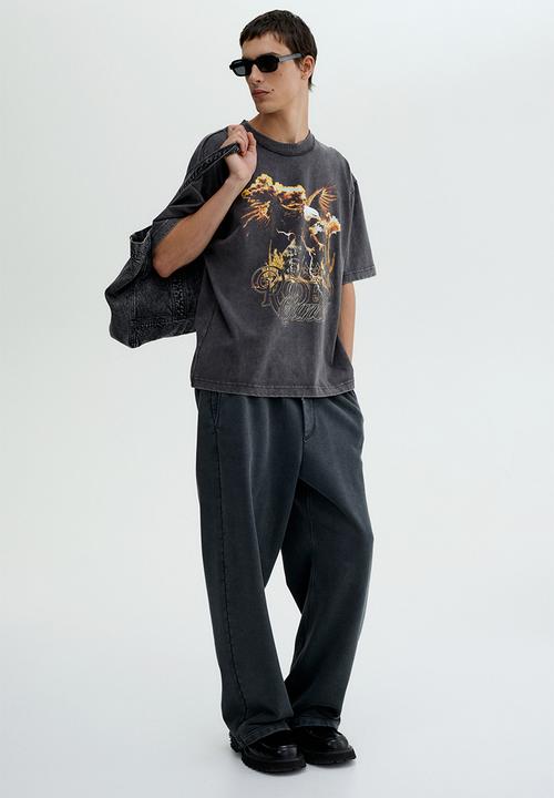 H&M - Loose fit printed t-shirt - vintage black rodeo sunset