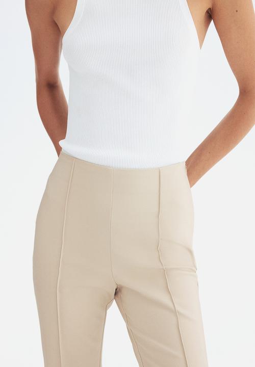H&M - Flared crease-front trousers - light beige