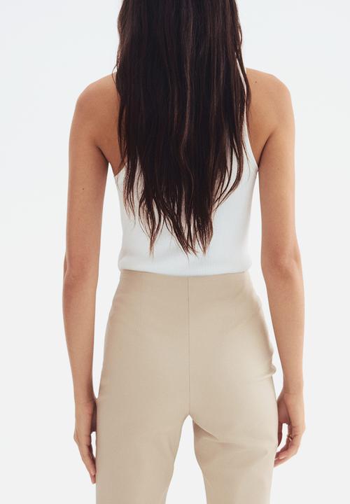 H&M - Flared crease-front trousers - light beige