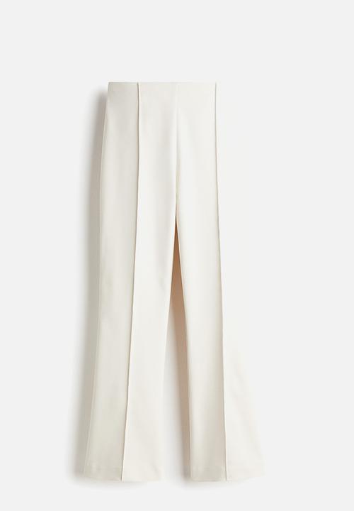 H&M - Flared crease-front trousers - white