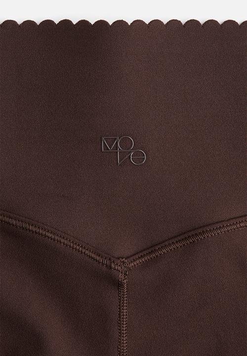 H&M - Flared sports leggings with softmove™ - warm brown 