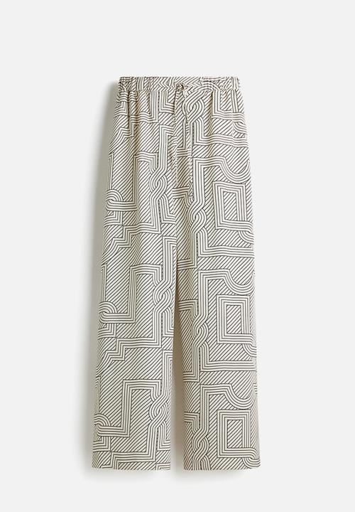 H&M - Wide trousers - cream patterned 