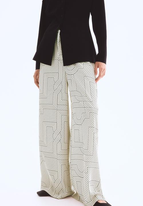 H&M - Wide trousers - cream patterned 