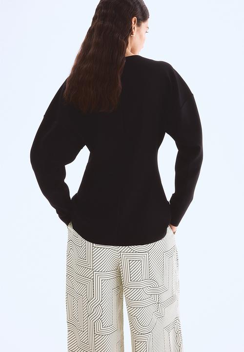 H&M - Wide trousers - cream patterned 