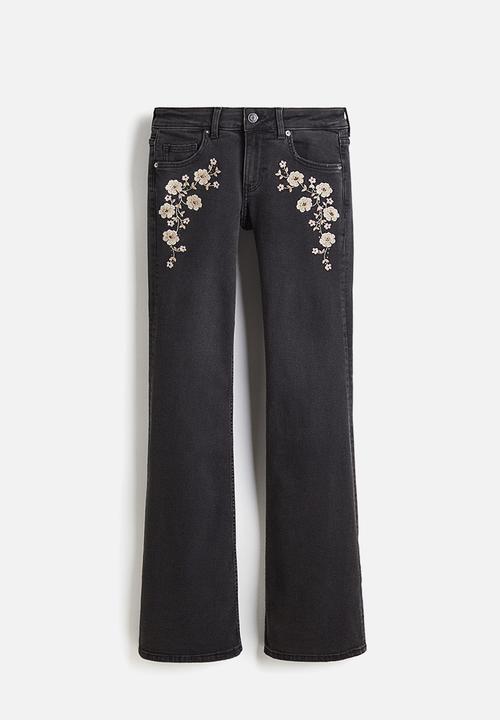 H&M - Flared low jeans - dark grey flowers 