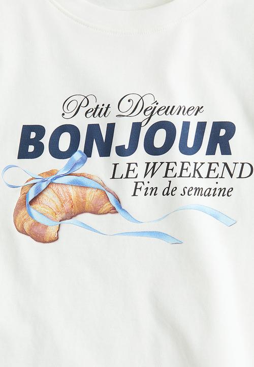 H&M - Oversized cotton T-shirt - white/bonjour
