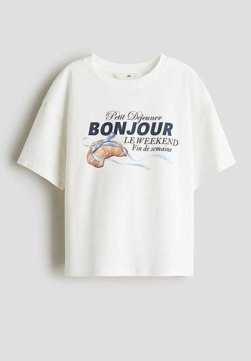 H&M - Oversized cotton T-shirt - white/bonjour