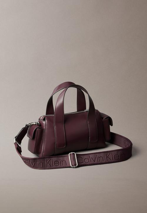 Calvin Klein - Webbing Strap Pocket Handbag- Fudge