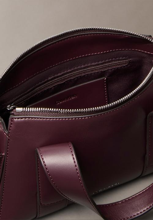 Calvin Klein - Webbing Strap Pocket Handbag- Fudge