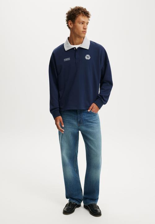 Cotton On - Cropped Fit Graphic Fleece Polo - Indigo Four Tune