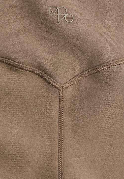 H&M - Flared sports leggings with softmove™ - dark beige