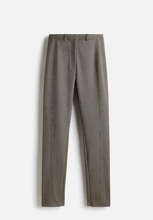 H&M - Fitted jersey trousers - light beige/dogtooth pattern 
