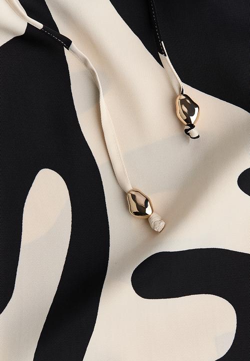 H&M - Wide drawstring trousers - cream & black patterned 