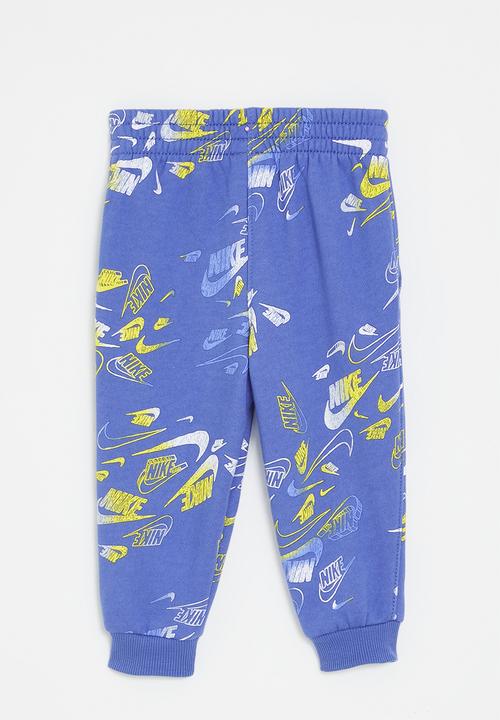 Nike - Nike all-over print reveal joggers - comet blue