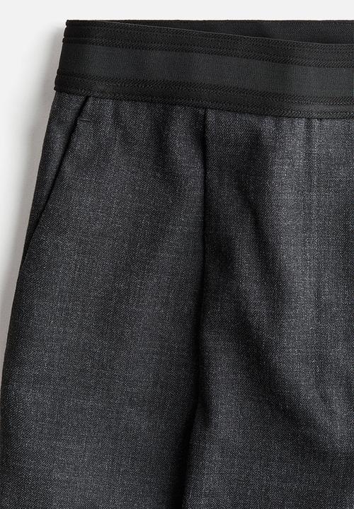H&M - Crease-leg trousers - dark grey marl 