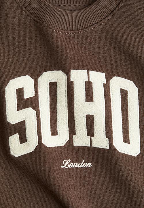 H&M - Printed crew-neck sweatshirt -  brown/soho
