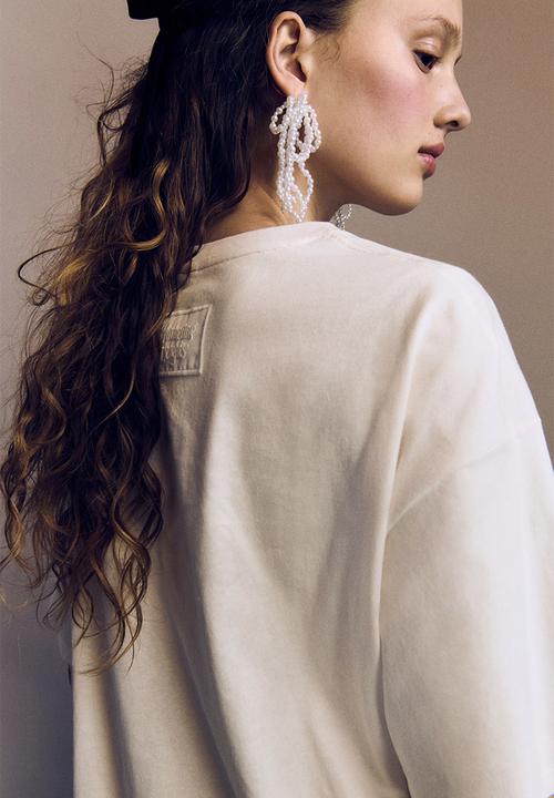 H&M - Oversized printed T-shirt - Cream Wuthering Heights