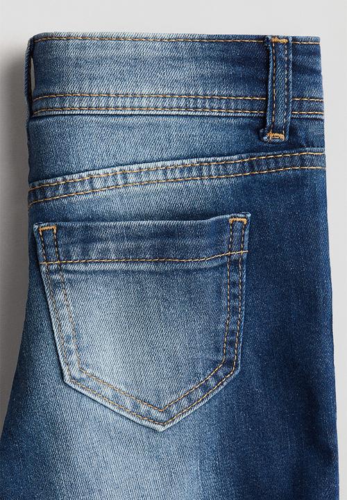H&M - Flared leg low jeans - denim blue/light denim blue
