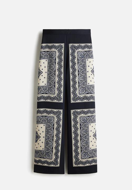 H&M - Straight trousers - navy blue/patterned 