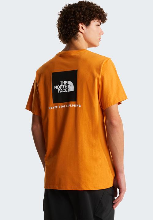 The North Face - M Evolution Box Nse Regular Short Sleeve Tee - Dust Orange
