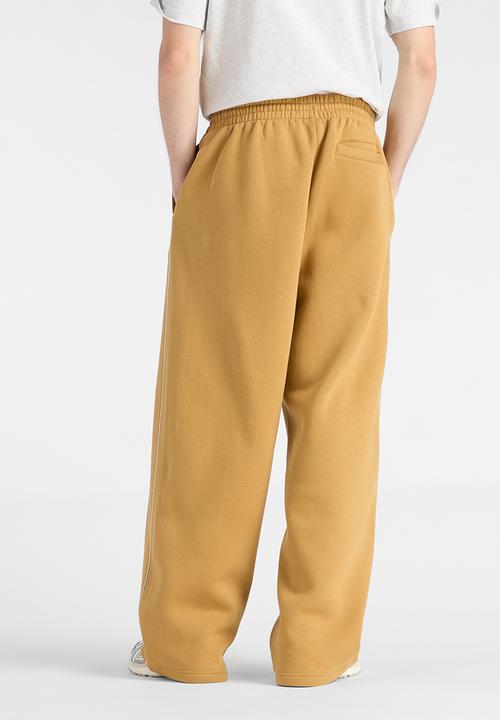 New Balance  - New Balance Linear Graphic Brushed Fleece Pant - Brown