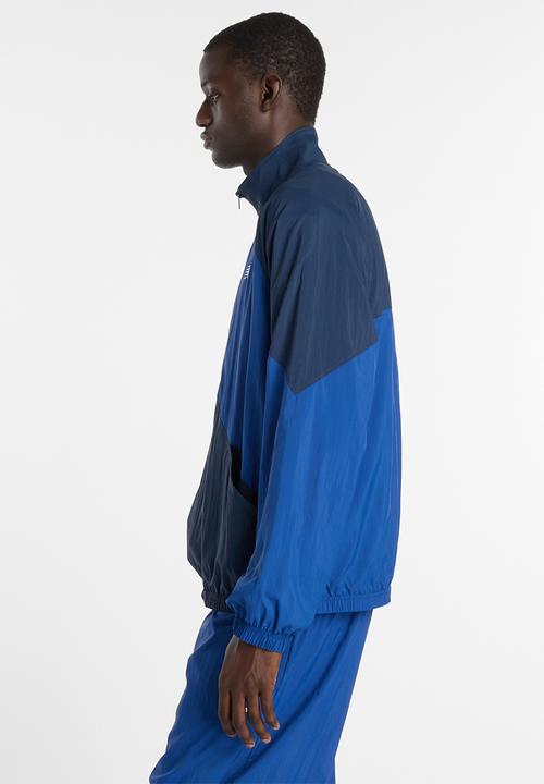 New Balance  - NB Athletics Sport Legacy Jacket - Blue
