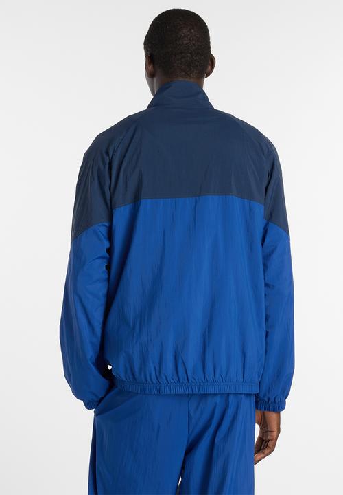 New Balance  - NB Athletics Sport Legacy Jacket - Blue