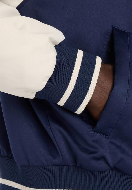 New Balance  - NB Athletics Varsity Jacket - Blue