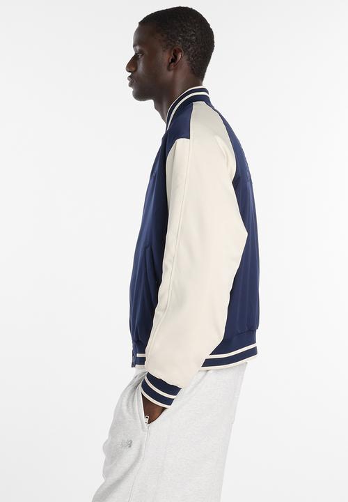 New Balance  - NB Athletics Varsity Jacket - Blue