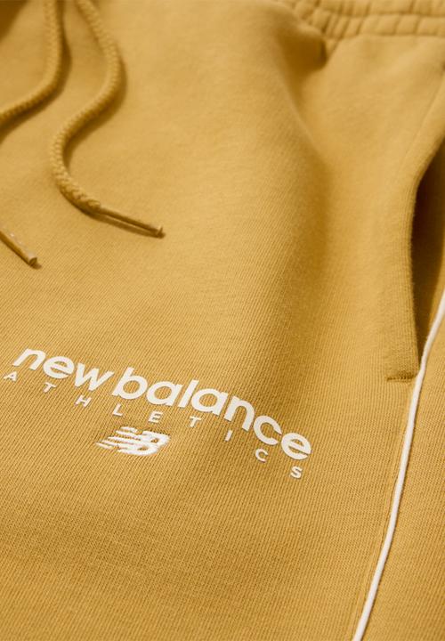 New Balance  - New Balance Linear Graphic Brushed Fleece Pant - Brown