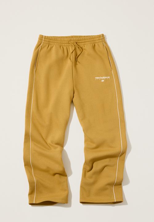 New Balance  - New Balance Linear Graphic Brushed Fleece Pant - Brown