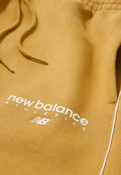 New Balance  - New Balance Linear Graphic Brushed Fleece Pant - Brown