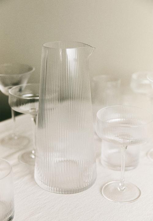 Fluted glass carafe - transparent
