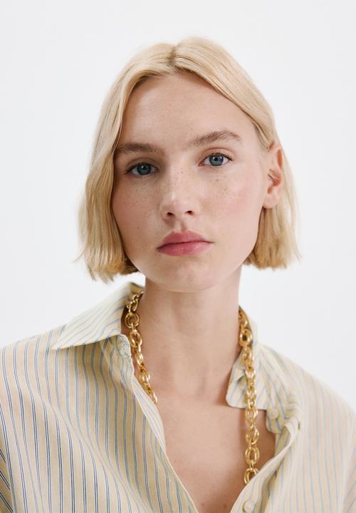 MANGO - Shirt poke - light/pastel yellow