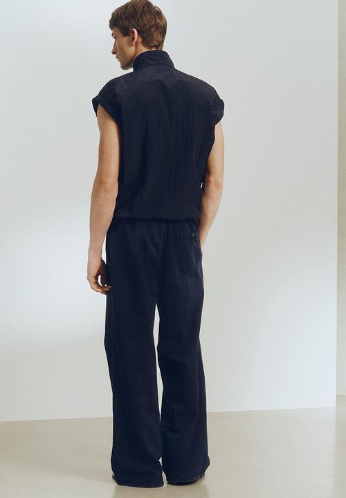 H&M - H&M Atelier: Loose fit linen-blend trousers - navy blue