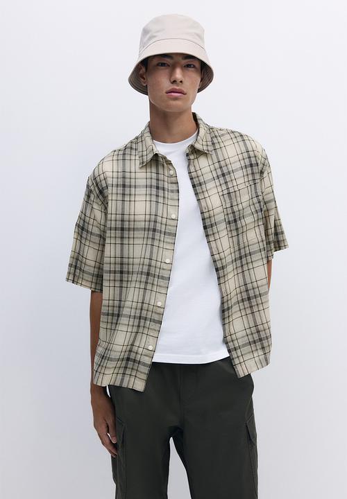 H&M - Relaxed fit short-sleeved shirt - beige/brown checked